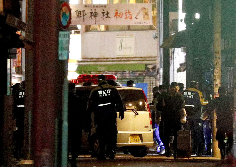 A car is inspected by police after it injured several pedestrians on Takeshita Street in Tokyo, early Tuesday, Jan. 1, 2019. A car slammed into pedestrians early Tuesday on a street where people had gathered for New Year's festivities in downtown Tokyo.(Yuta Omori/Kyodo News via AP)