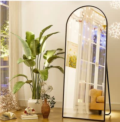 A 64-inch arched full-length mirror ( $139 off list price)