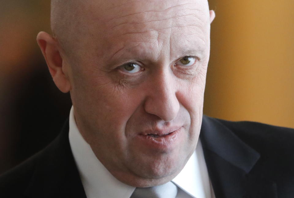 A portrait of Yevgeny Prigozhin, looking unblinkingly up at the camera.