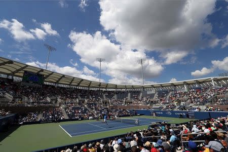 Aug 30, 2016; New York, NY, USA; Kei Nishikori of Japan (L) hits a forehand against Benjamin Becker of Germany (R) on day two of the 2016 U.S. Open tennis tournament at USTA Billie Jean King National Tennis Center. Geoff Burke-USA TODAY Sports