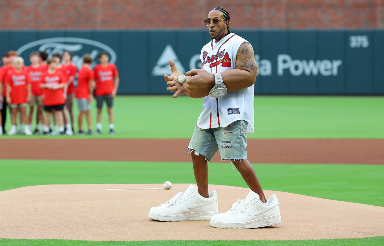 Ludacris throwing out the first pitch before the Atlanta Braves game. (Kevin C. Cox / Getty Images)