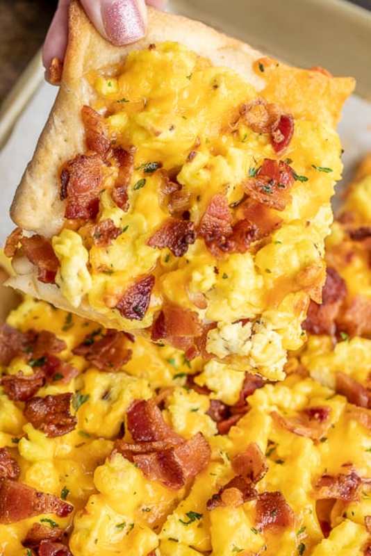 <p>Plain Chicken</p><p>Here, refrigerated pizza dough is topped with ranch dressing, scrambled eggs, bacon, and cheddar cheese. We love this for breakfast, lunch, and dinner. </p><p><strong>Get the recipe: <a href="https://www.plainchicken.com/cracked-out-breakfast-pizza/" rel="nofollow noopener" target="_blank" data-ylk="slk:Cracked Out Breakfast Pizza;elm:context_link;itc:0;sec:content-canvas" class="link ">Cracked Out Breakfast Pizza</a></strong></p>