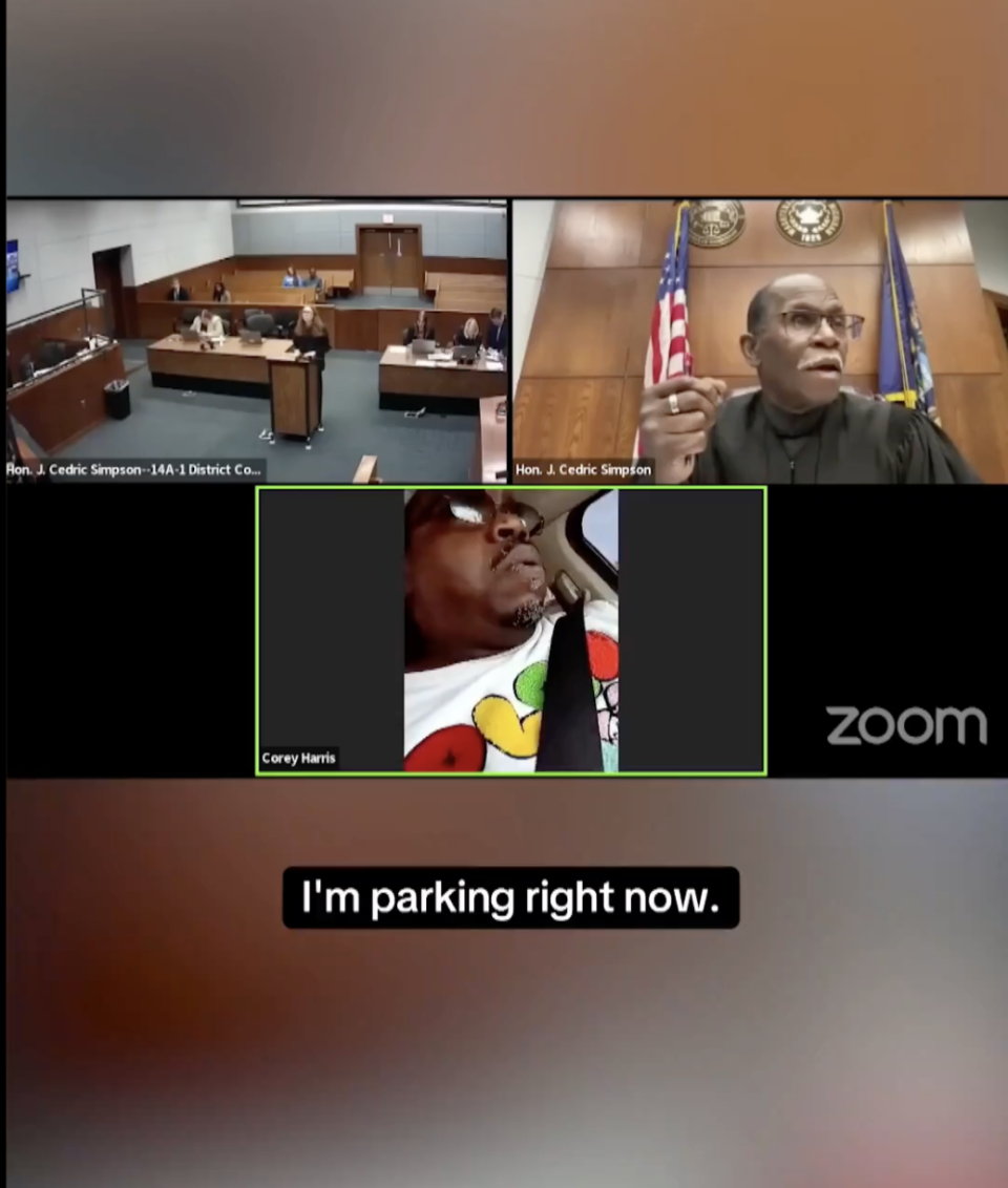 Judge Cedric Simpson presides over a courtroom Zoom call with Corey Harris, who appears to be in his car. Harris says, "I'm parking right now."