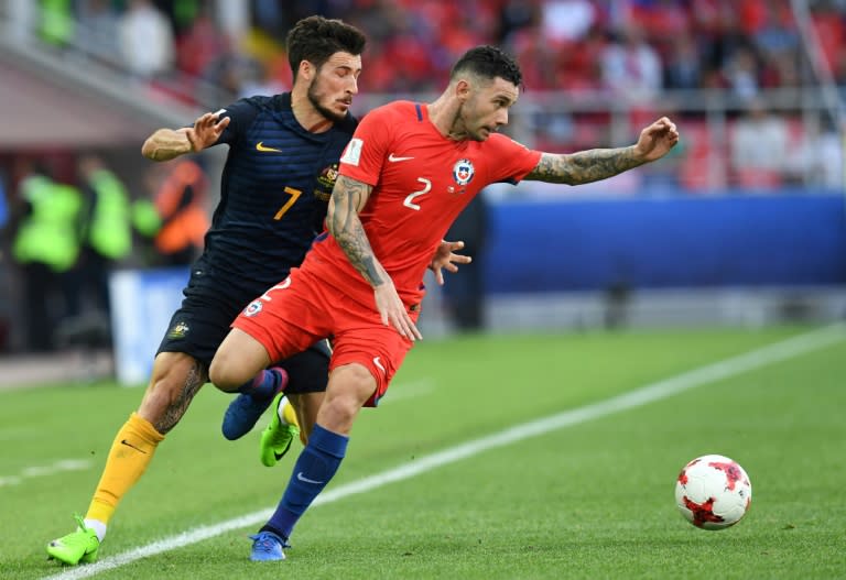 Australia's forward Mathew Leckie (L) vies with Chile's defender Eugenio Mena during the 2017 Confederations Cup group B football match June 25, 2017