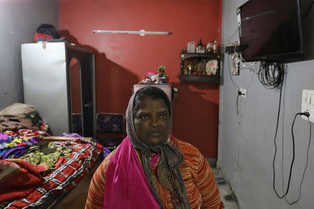 Sugana, mother of Prabhu Dhandapani who was detained by police on the suspicion of being involved in illegally sending people to New Zealand on a boat, looks on inside her house in New Delhi, January 23, 2019. REUTERS/Anushree Fadnavis