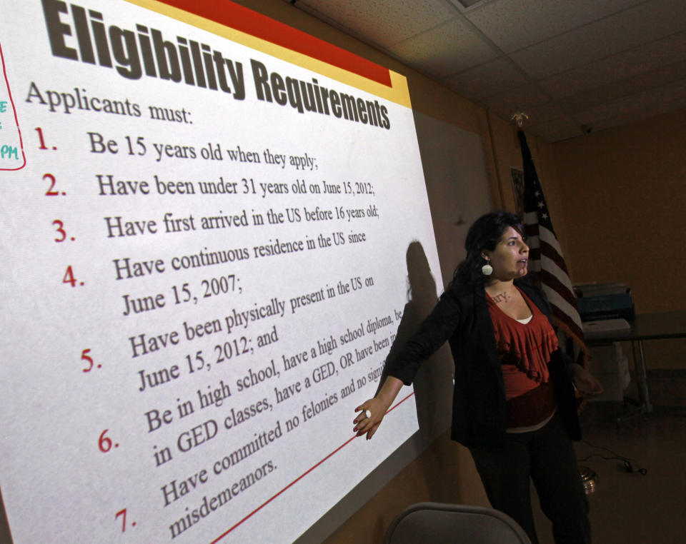 Charlene Gomez conducts an orientation seminar for illegal immigrants, to determine if they qualify for temporary work permits, at the Coalition for Humane Immigrant Rights of Los Angeles (CHIRLA), in Los Angeles, Thursday, Sept. 20, 2012. Schools and consulates have been flooded with requests for documents since President Barack Obama’s administration said many young illegal immigrants may be eligible for two-year renewable work permits. The new policy has left schools and consulates scrambling for quick fixes ranging from new online forms, reassigned workers and extended hours. (AP Photo/Reed Saxon)