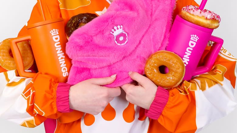 Person holding Dunkin' merchandise