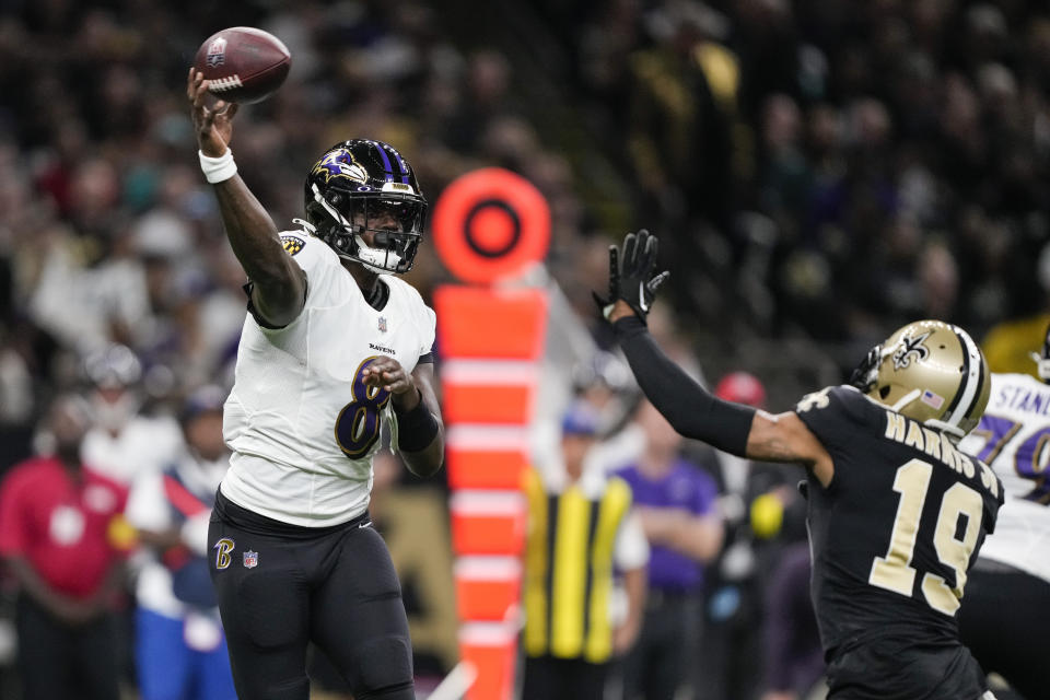 Baltimore Ravens quarterback Lamar Jackson (8) throws under pressure from New Orleans Saints safety Chris Harris Jr., (19) in the first half of an NFL football game in New Orleans, Monday, Nov. 7, 2022. (AP Photo/Gerald Herbert)
