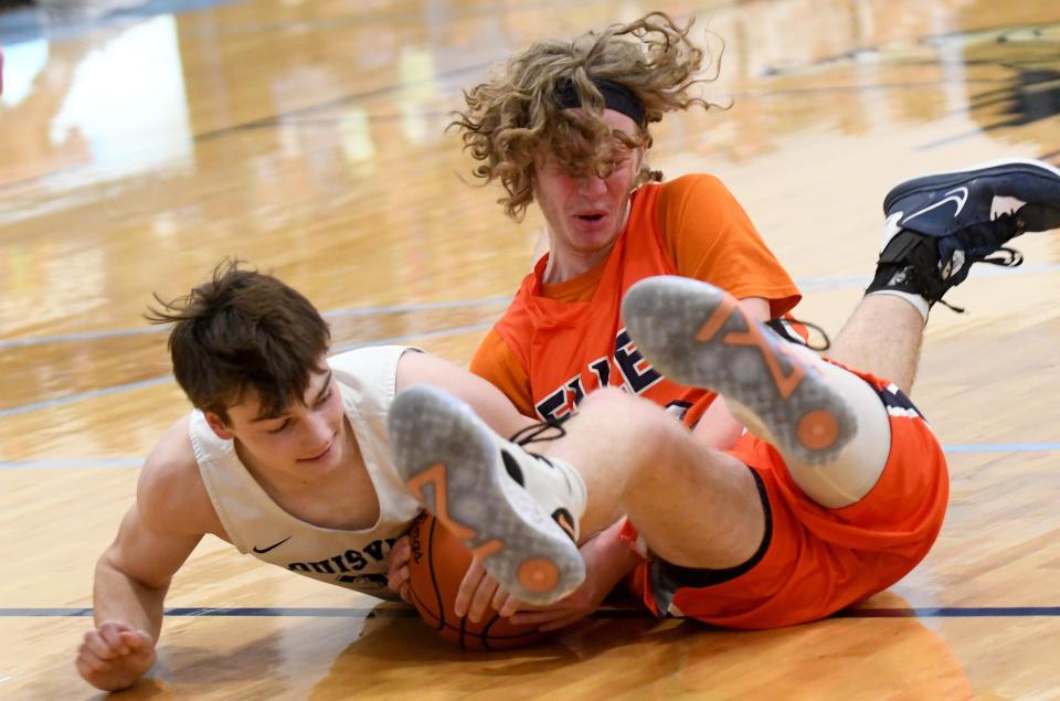 Louisville's Cam Dougherty and Ellet's Jackson Taylor fight for a loose ball in the first half of Saturday's game.