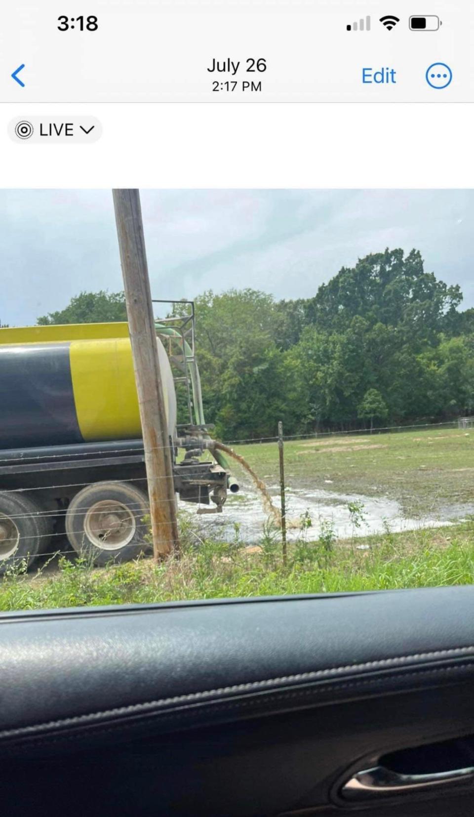 A cell phone photo captured near Pleasant Hope on July 26, 2023 shows a tanker truck dumping waste water in a pasture. Land application of waste water is supposed to be spread evenly over a field, not to exceed 1 acre inch per day.