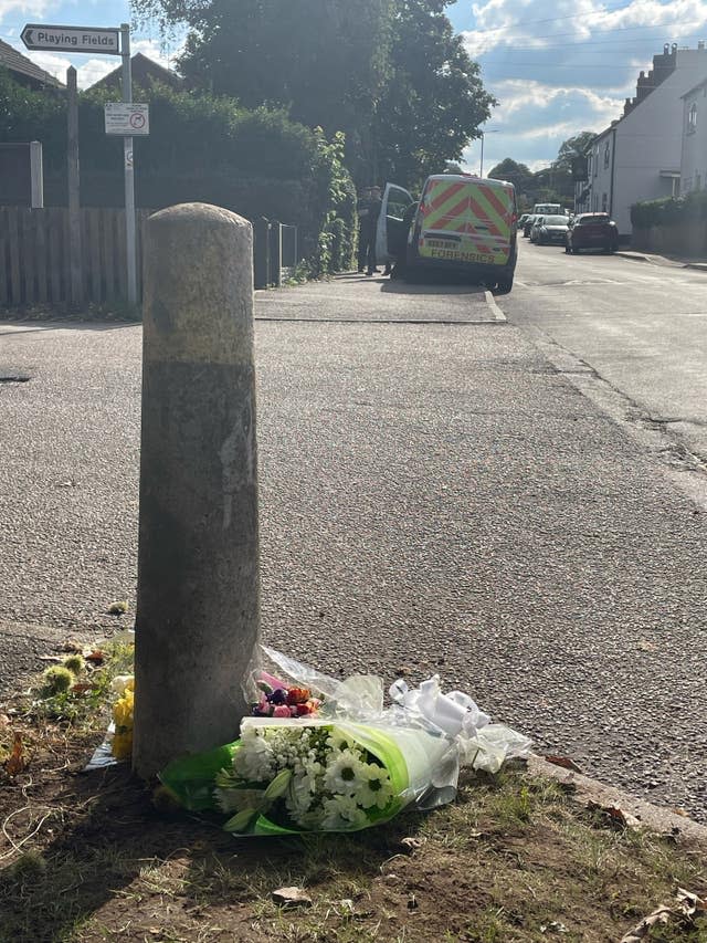 Floral tributes left near the scene of the attack in which Ian Price died