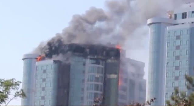 Bystanders in Odessa watched on in shock as flames reached all the way up the enormous 22-storey Gagarin Plaza on Saturday, with thick black smoke filling the sky. Photo: LiveLeak