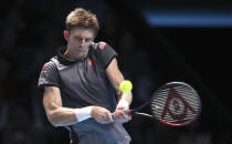 South Africa's Kevin Anderson plays a return to Switzerland's Roger Federer during their ATP World Tour Finals men's singles tennis match at the O2 arena in London, Thursday, Nov. 15, 2018. (John Walton/PA via AP)