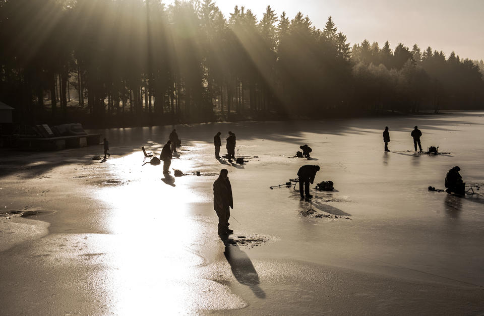 Fisherman on ice covered lake near the Nove Mesto