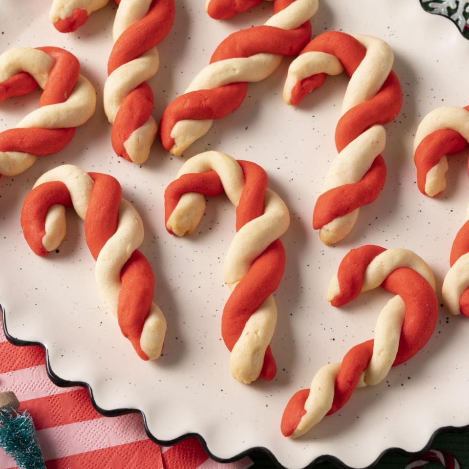 candy cane cookies on white plate