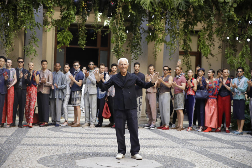 Designer Giorgio Armani accepts applause at the end of the Armani men's Spring-Summer 2020 collection, unveiled during the fashion week, in Milan, Italy, Monday, June 17, 2019. (AP Photo/Luca Bruno)