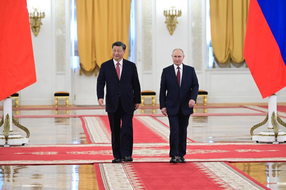 Russian President Vladimir Putin, right, and Chinese President Xi Jinping attend an official welcome ceremony at The Grand Kremlin Palace, in Moscow, Russia, Tuesday, March 21, 2023. (Pavel Byrkin, Sputnik, Kremlin Pool Photo via AP)