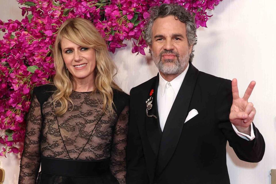 <p> JC Olivera/Getty</p> Sunrise Coigney and Mark Ruffalo on the red carpet at the 2024 Oscars