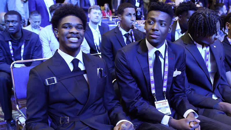 Scoot Henderson, left, and Brandon Miller attend the NBA basketball draft lottery in Chicago, Tuesday, May 16, 2023. 
