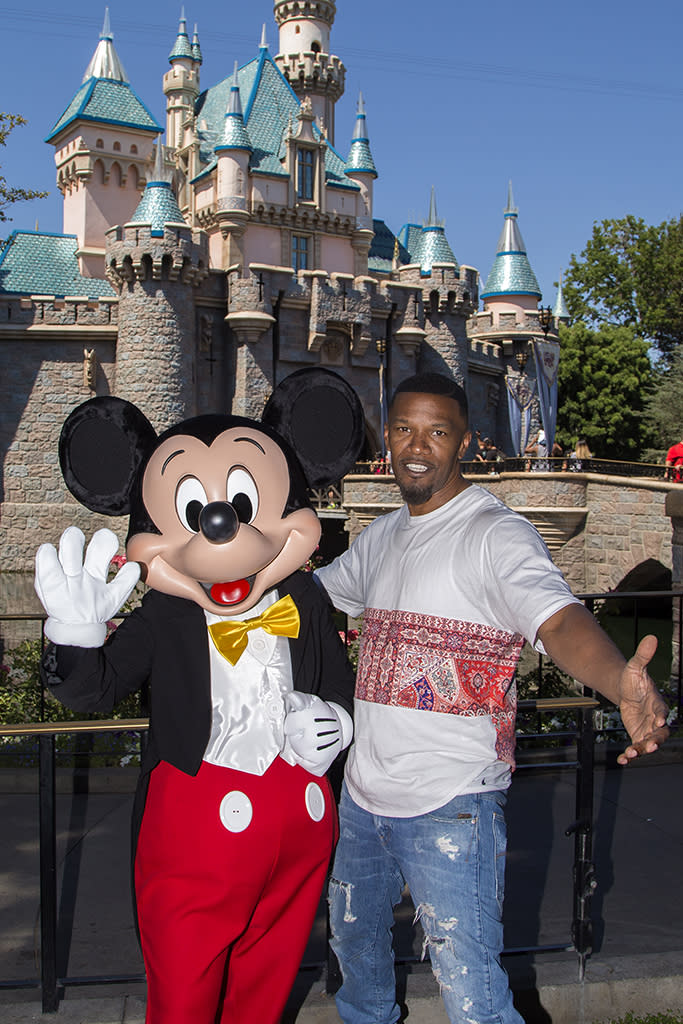 <p>When you’re a celeb as big as Foxx, you get perks, such as meeting Mickey Mouse during your visit to the Magic Kingdom. (Photo: Joshua Sudock/Disneyland Resort via Getty Images) </p>