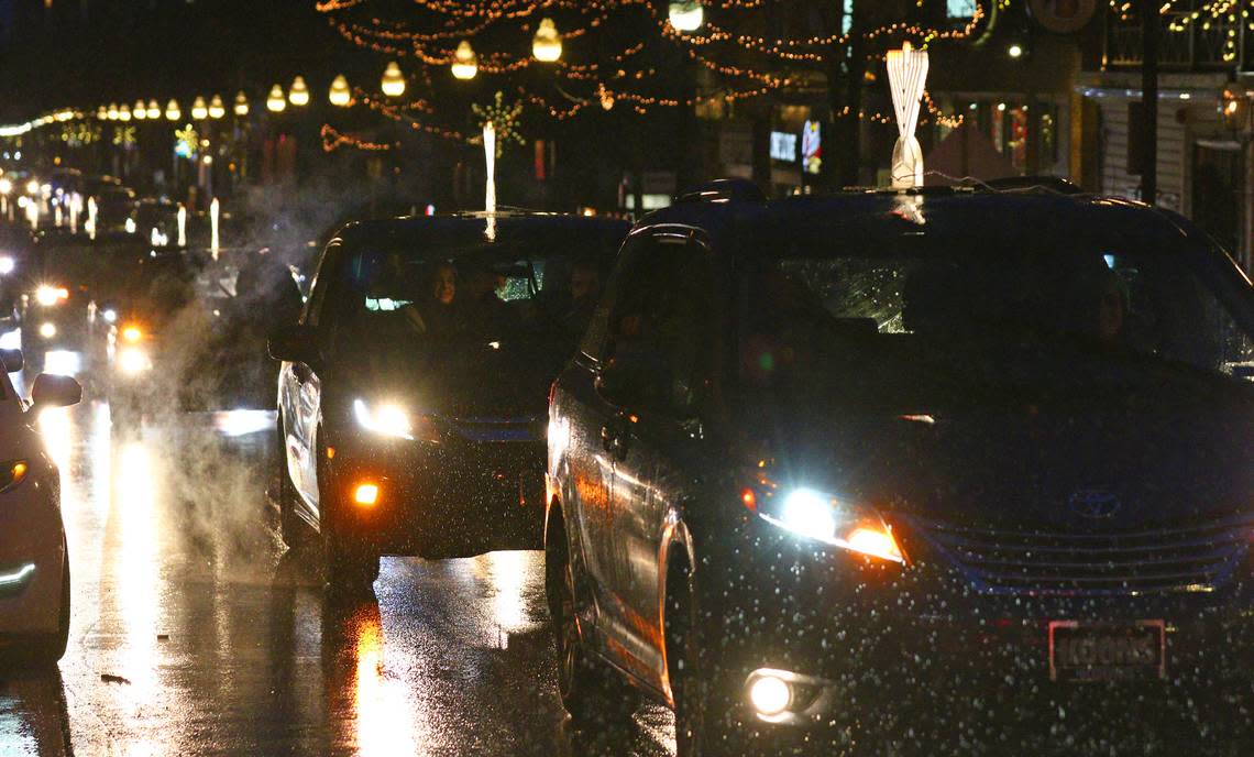 Twenty-five cars took part in the Menorah Car Parade Sunday in downtown State College before the lighting of a 6 foot tall public Jewish Hanukkah menorah at Old Main.