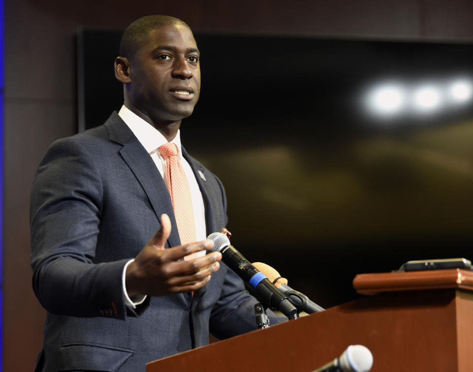 Auburn University director of athletics Allen Greene introduces new radio voice of Auburn (University) sports, Andy Burcham,  Monday, Aug. 12, 2019, in Auburn, Ala. Burcham replaces Rod Bramblett after Bramblett and his wife Paula Bramblett were killed in a car wreck on May 25, 2019. (Todd Van Emst photo via AP)