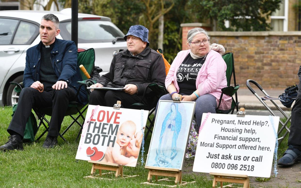 Protesters outside the Marie Stopes clinic in Ealing have been told they must stay 100m from the building - PA