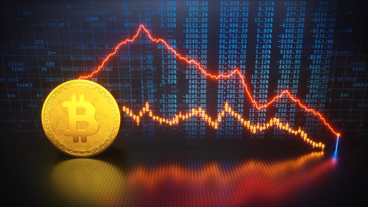 An abstract composition of a golden bitcoin and graph financial data, representing currency stock crash.

