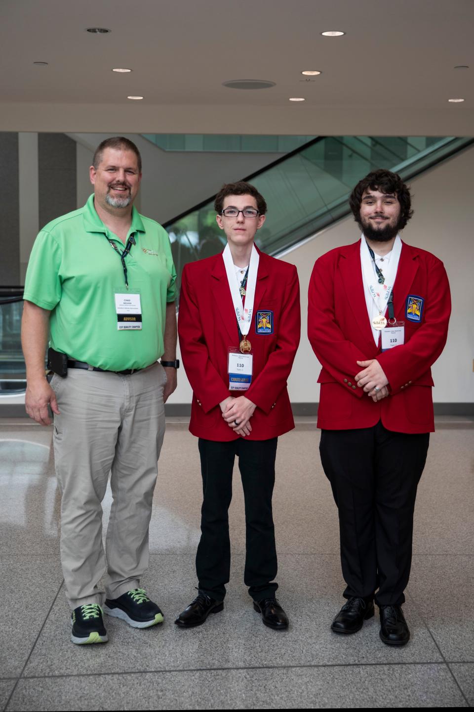 McKinley High School engineering students Collin Morrison, center, and Kaden Smith, right, will compete in the SkillsUSA National Leadership & Skills Conference. They are pictured with McKinley engineering teacher Chad Weaver.