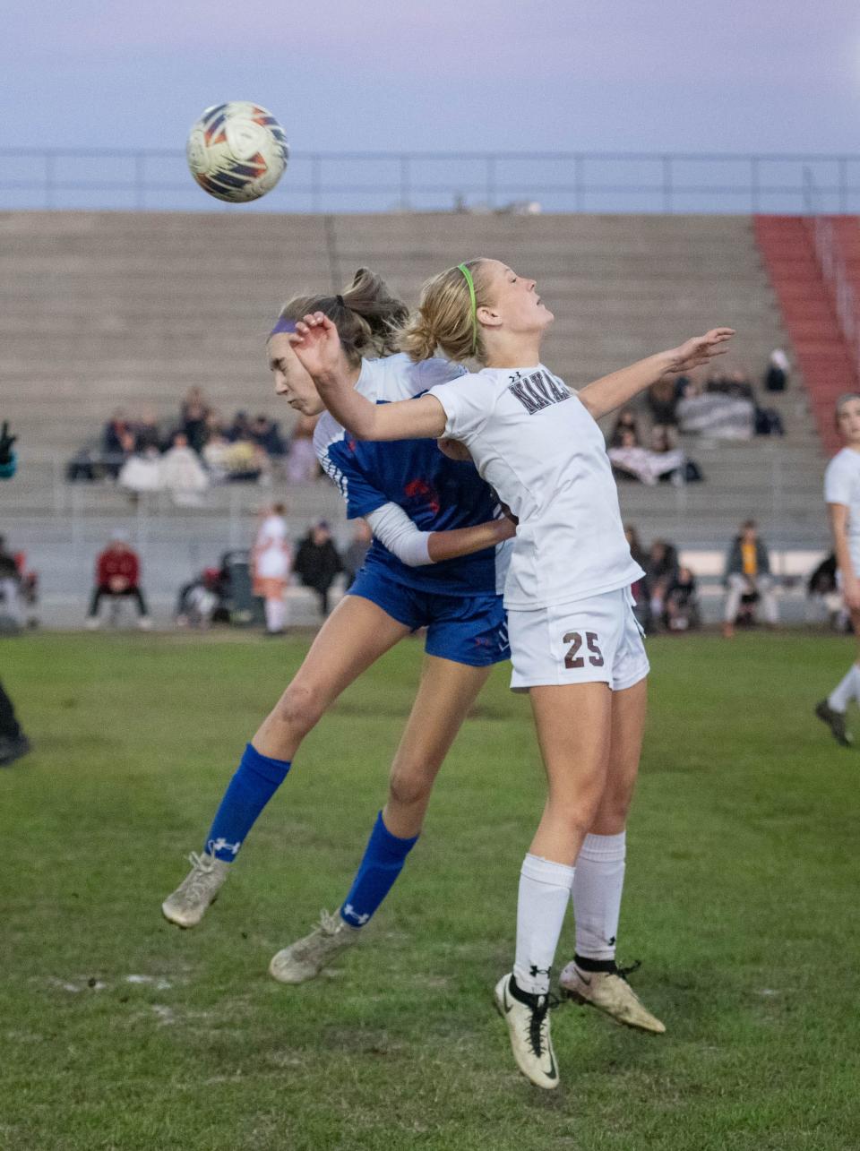 Maddie Motes (7) and Kaitlyn Lawson (25) vie for the ball during the Pace vs Navarre girls District 1-6A Tournament soccer game at Navarre High School on Friday, Jan. 27, 2023.