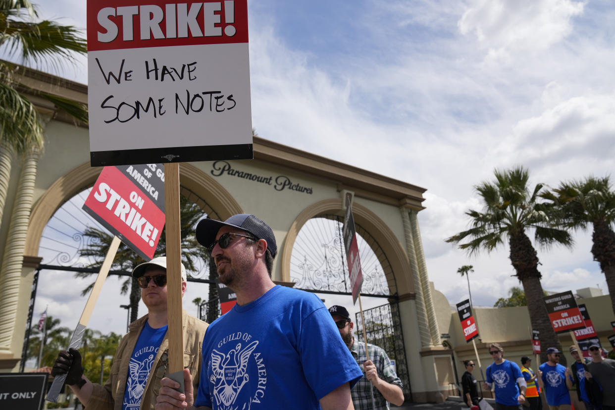 Members of the The Writers Guild of America picket outside Paramount Pictures on Wednesday, May 3, 2023, in Los Angeles. Television and movie writers declared late Monday, May 1, that they will launch an industrywide strike for the first time in 15 years, as Hollywood girded for a walkout with potentially widespread ramifications in a fight over fair pay in the streaming era.(AP Photo/Ashley Landis)