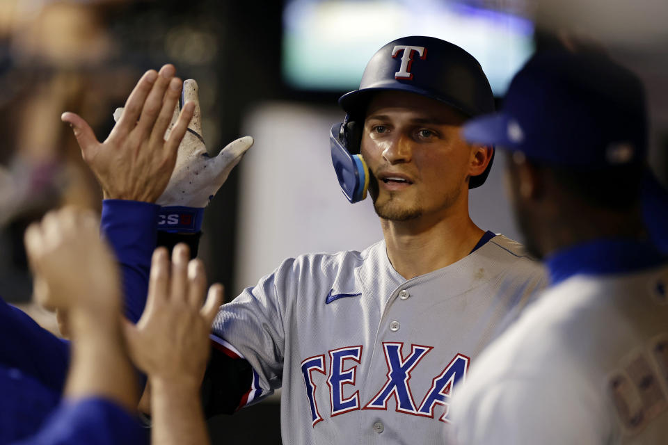 Texas Rangers' Corey Seager is congratulated for his home run against the New York Mets during the fourth inning of a baseball game Wednesday, Aug. 30, 2023, in New York. (AP Photo/Adam Hunger)