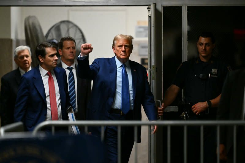 Former President Donald Trump returns from a break in his trial at Manhattan criminal court in New York on Thursday. Pool Photo by Angela Weiss/UPI