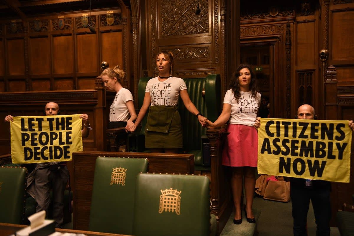Handout photo taken with permission from the twitter feed of Extinction Rebellion of protesters who have superglued themselves around the Speaker’s chair in the House of Commons chamber, as they call for a Citizen’s Assembly. Picture date: Friday September 2, 2022 (Extinction Rebellion/PA) (PA Media)