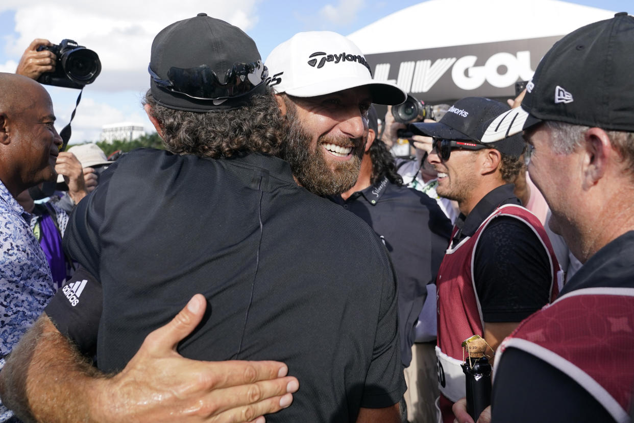 Dustin Johnson celebrates after his 4 Aces GC team won the LIV Golf Team Championship at Trump National Doral Golf Club, Sunday, Oct. 30, 2022, in Doral, Fla. (AP Photo/Lynne Sladky)