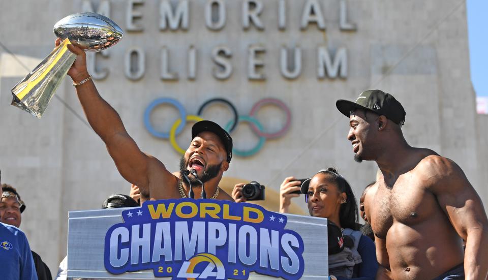 Los Angeles, California February 16, 2022: Rams defensive end Aaron Donald holds the Championship trophy during a parade in front of the Coliseum Wednesday. (Wally Skalij/Los Angeles Times via Getty Images)