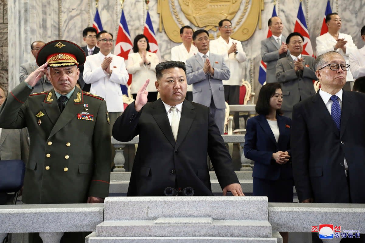 North Korean leader Kim Jong-un, center, Russian defence minister Sergei Shoigu, left, and China’s Vice Chairman of the standing committee of the country’s National People’s Congress Li Hongzhong, right, attend a military parade to mark the 70th anniversary of the armistice that halted fighting in the 1950-53 Korean War, on Kim Il Sung Square in Pyongyang (AP)