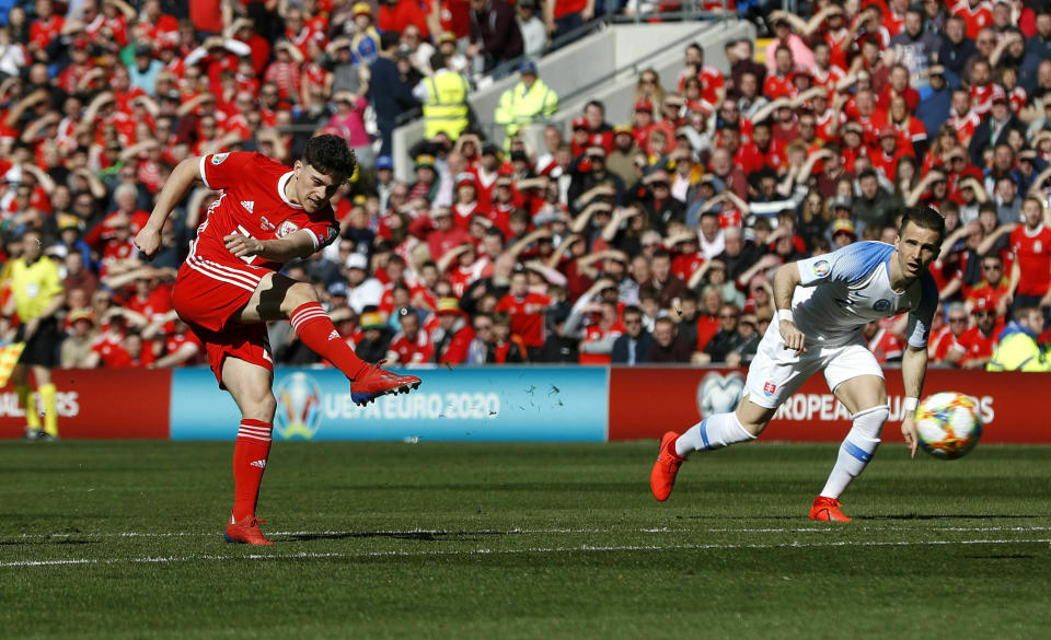 Wales' Daniel James scores against Slovakia during the Euro 2020 qualifying, Group E soccer match at the Cardiff City Stadium, Wales, Sunday March 24, 2019. (Darren Staples/PA via AP)