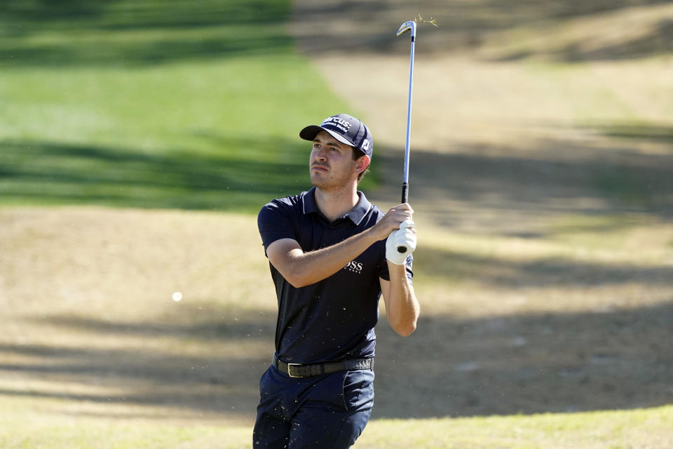 Patrick Cantlay hits from a bunker off the 18th fairway during the first round of The American Express golf tournament on the Nicklaus Tournament Course at PGA West, Thursday, Jan. 21, 2021, in La Quinta, Calif. (AP Photo/Marcio Jose Sanchez)