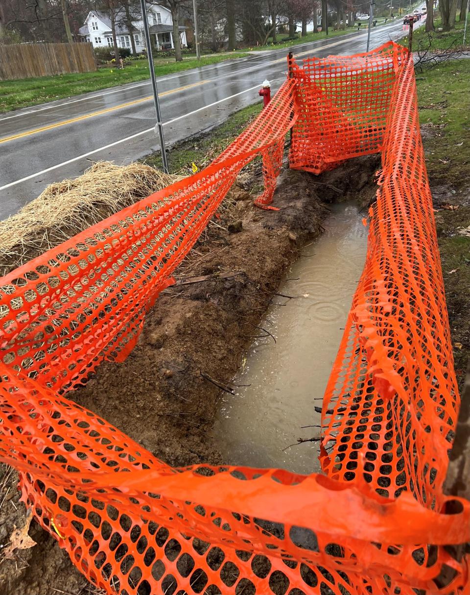 This hole was left by Enbridge crews in Tess Bennett's front yard as a part of its natural gas pipeline replacement project. The hole is supposed to be filled in and landscaped once the work is complete.
