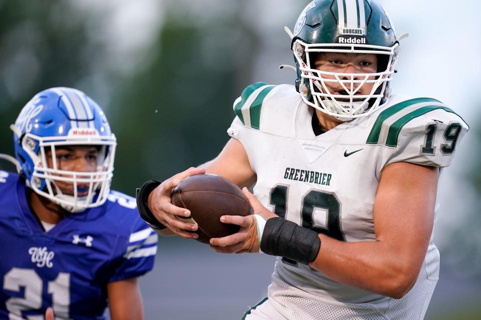 Greenbrier's Nathan Robinson (19) runs the ball against White House during the first quarter in White House, Tenn., Thursday, Aug. 25, 2022.