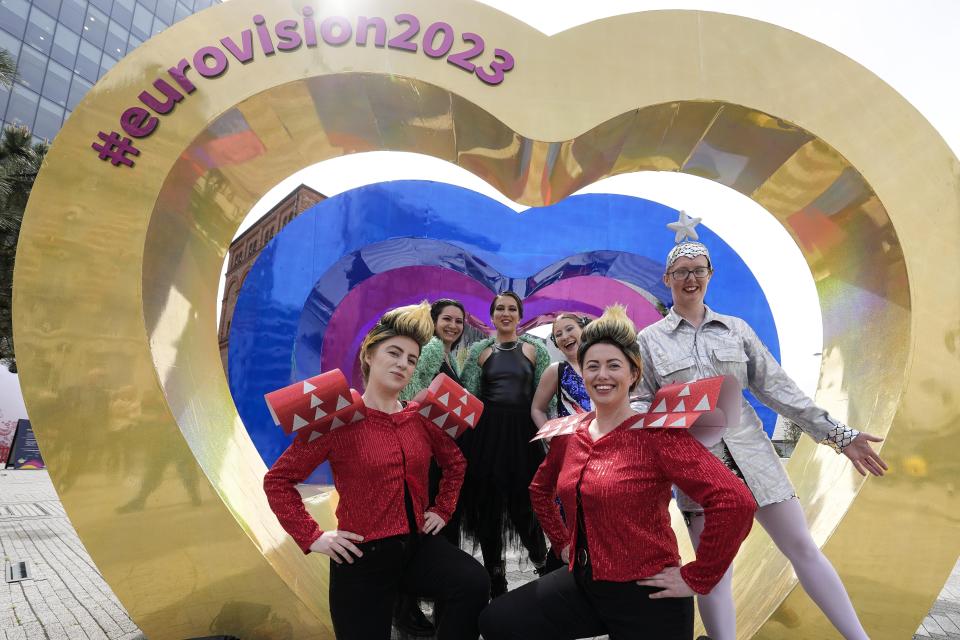 Eurovision fans pose ahead of the first semifinal at the Eurovision Song Contest in Liverpool, England, Tuesday, May 9, 2023. (AP Photo/Martin Meissner)