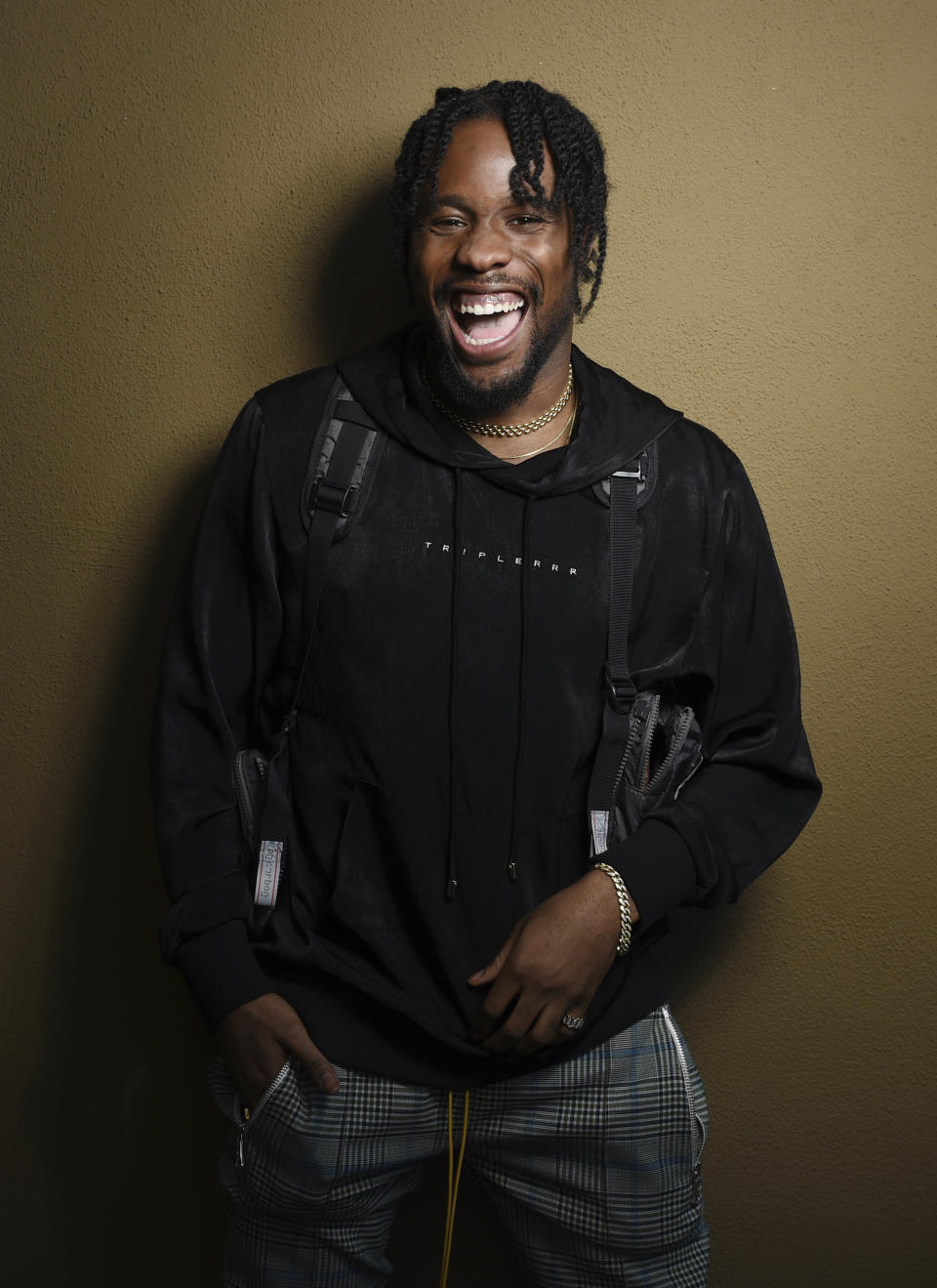 In this Nov. 30, 2018 photo, Shameik Moore, a cast member in "Spider-man: Into the Spider-Verse," poses for a portrait at the Four Seasons Hotel in Los Angeles. (Photo by Chris Pizzello/Invision/AP)