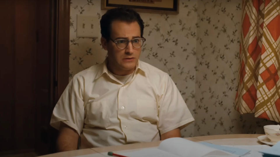 Michael Stuhlbarg sits at his kitchen table with an expression of confusion in A Serious Man.