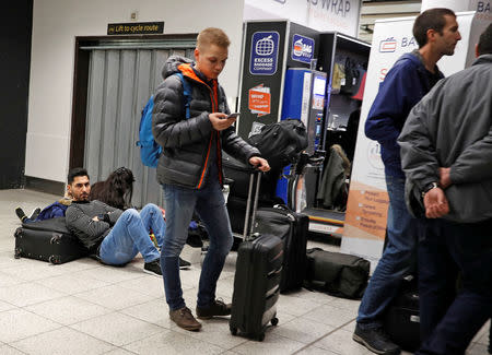 Passengers wait around in the South Terminal building at Gatwick Airport after drones flying illegally over the airfield forced the clossure of the airport, in Gatwick, Britain, December 20, 2018. REUTERS/Peter Nicholls