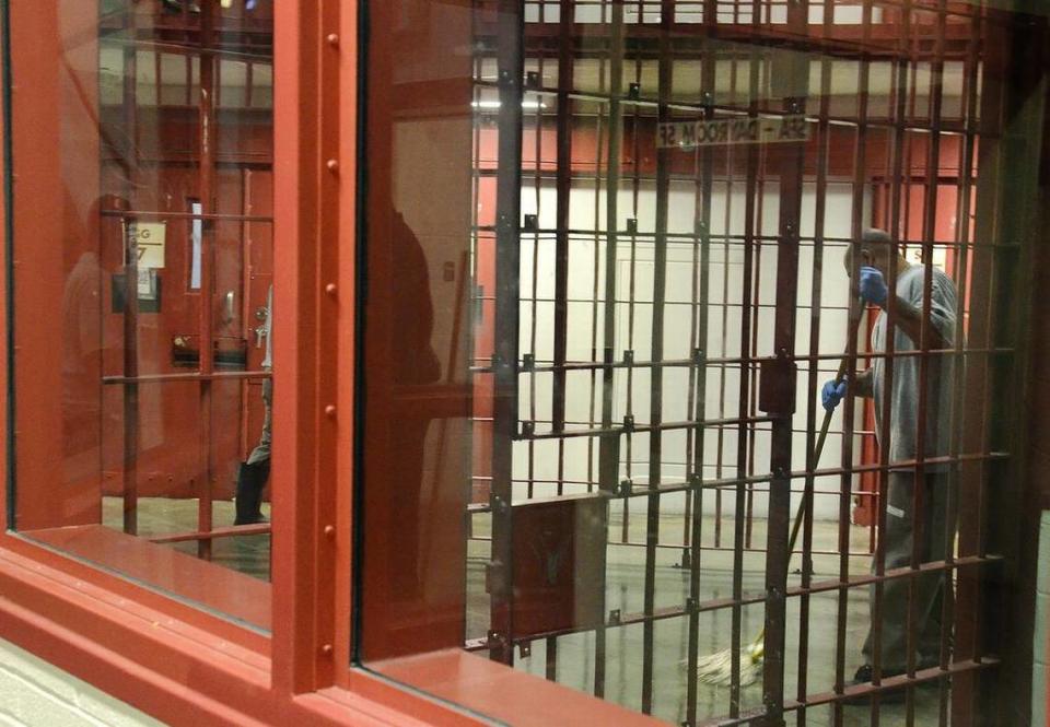 In this file photo, an inmate is shown mopping the floor at a prison in Anson County.