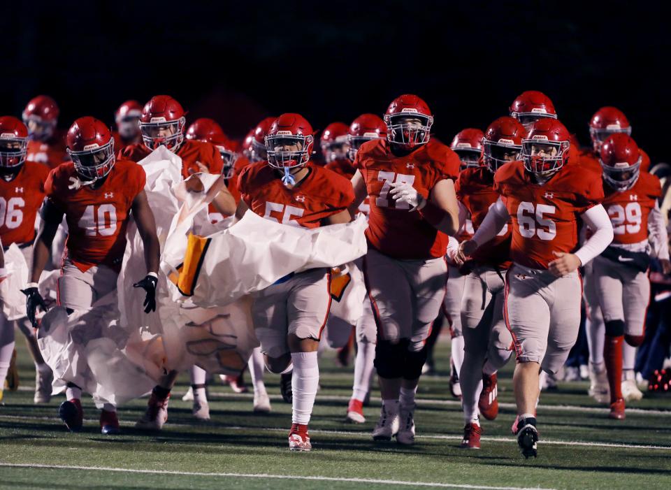 Brentwood Academy players take the field for their Division II-AAA semifinal playoff game against Baylor at Brentwood Academy Friday, November 18, 2022.
