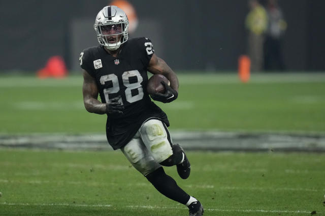 Las Vegas Raiders running back Josh Jacobs (28) walks off the