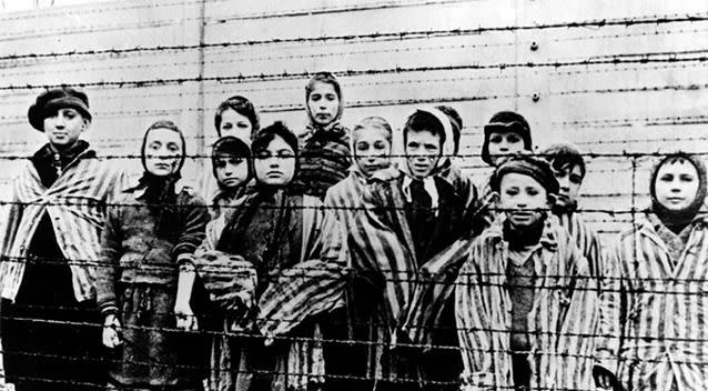 Children were made to wear the Auschwitz Nazi concentration camp uniform Photo: AP