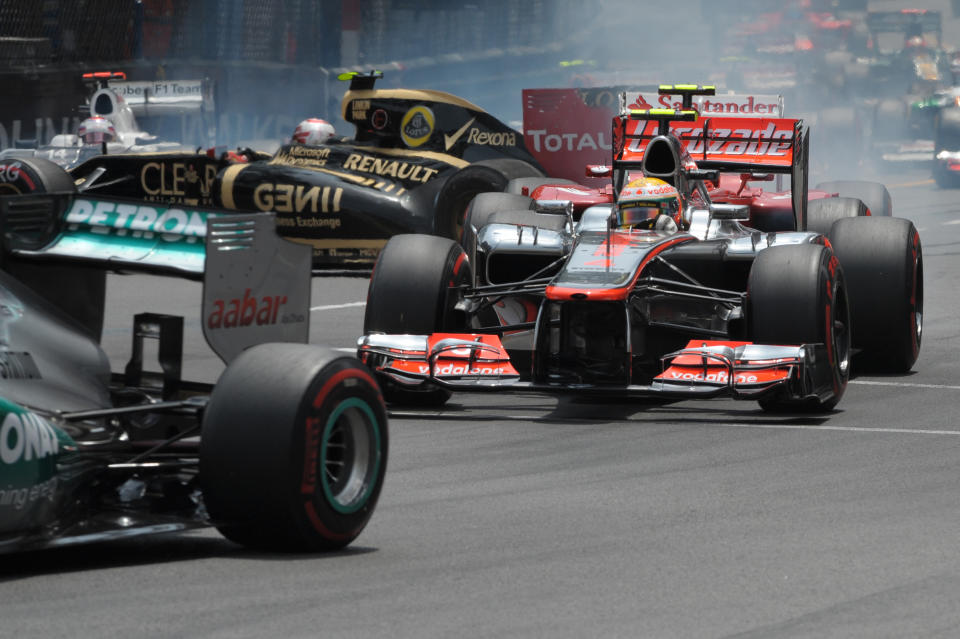 McLaren Mercedes' British driver Lewis Hamilton drives as Lotus F1 Team's French driver Romain Grosjean crashes at the Circuit de Monaco on May 27, 2012 in Monte Carlo during the Monaco Formula One Grand Prix. AFP PHOTO / TOM GANDOLFINITom Gandolfini/AFP/GettyImages